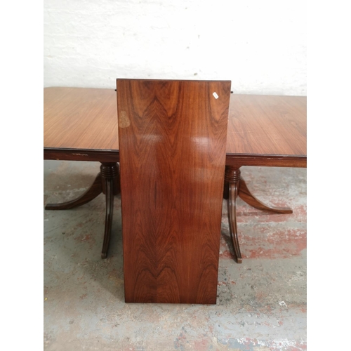 431 - A 19th century style simulated rosewood twin pedestal extending dining table