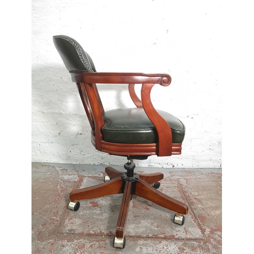 433 - A mahogany and green leather Captain's swivel office desk chair