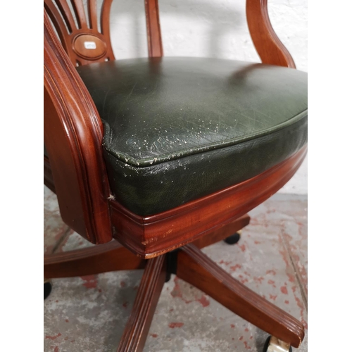 433 - A mahogany and green leather Captain's swivel office desk chair