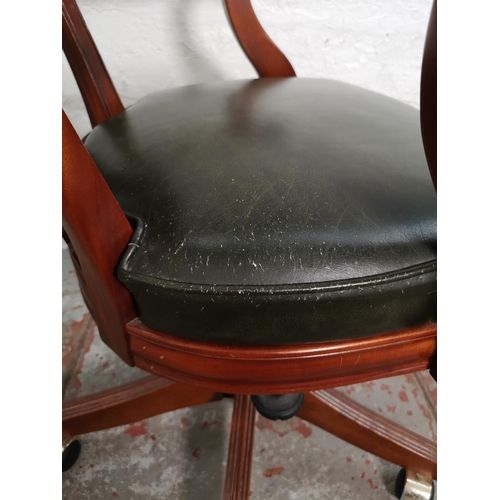 433 - A mahogany and green leather Captain's swivel office desk chair