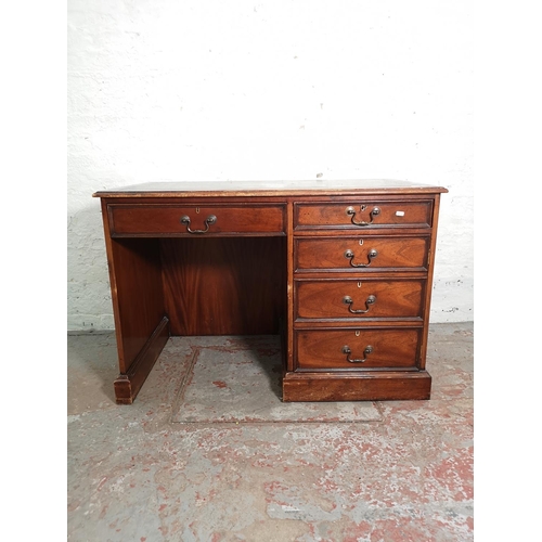 434 - A 19th century style mahogany pedestal desk with five drawers, green leather insert and brass swan n... 