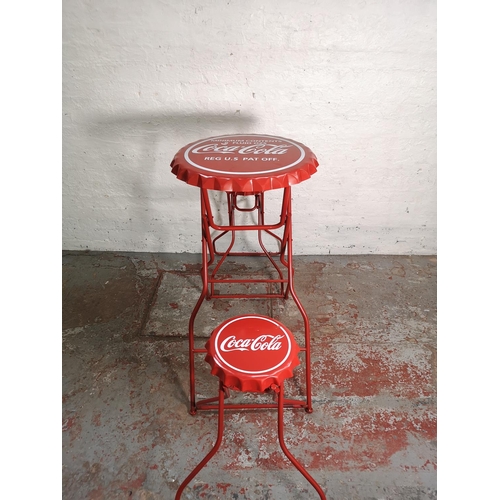 435 - A Coca-Cola red metal folding advertising bistro set with bottle cap design - table approx. 105cm hi... 