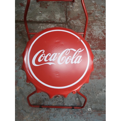 435 - A Coca-Cola red metal folding advertising bistro set with bottle cap design - table approx. 105cm hi... 