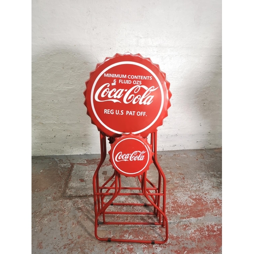 435 - A Coca-Cola red metal folding advertising bistro set with bottle cap design - table approx. 105cm hi... 