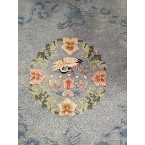 440 - An Oriental blue and cream circular tasselled rug - approx. 175cm in diameter