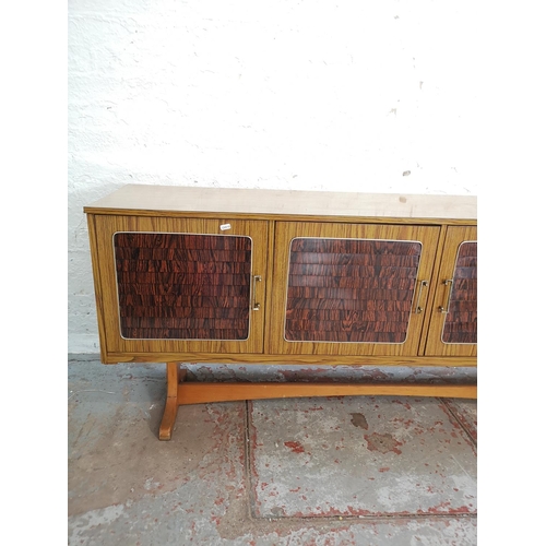 442 - A mid 20th century teak and rosewood effect sideboard with three cupboard doors and three drawers - ... 