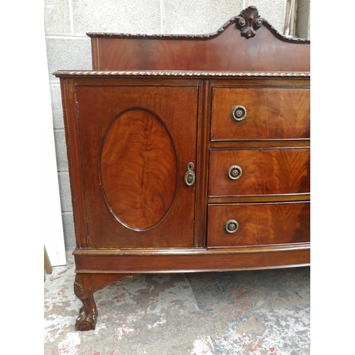 461 - A Georgian style mahogany bow fronted sideboard with carved acanthus leaf gallery back, two outer cu... 