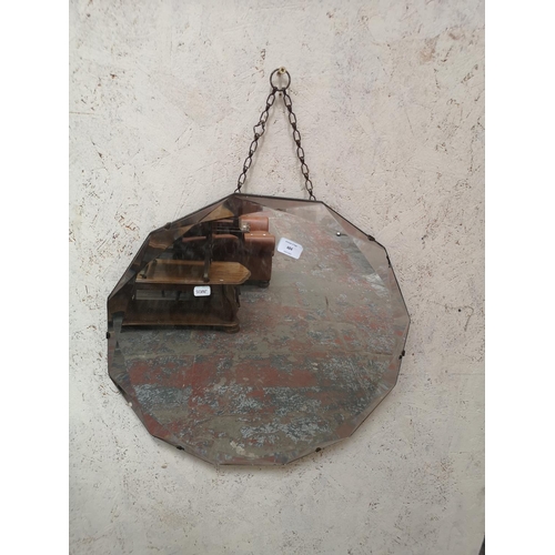 484 - A mid 20th century Art Deco style twelve sided bevelled edge wall hanging mirror