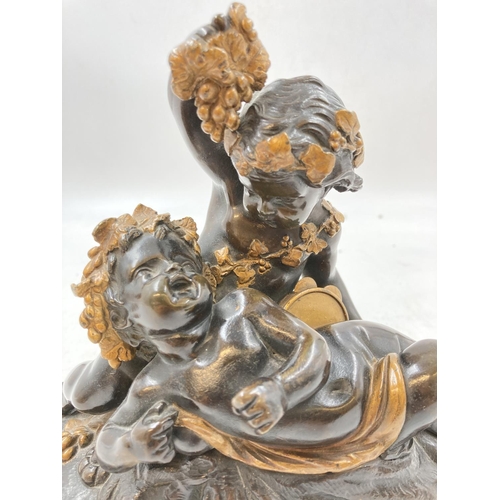 352 - A late 19th century French bronze and ormolu cherub sculpture wearing robes and holding grape vine -... 