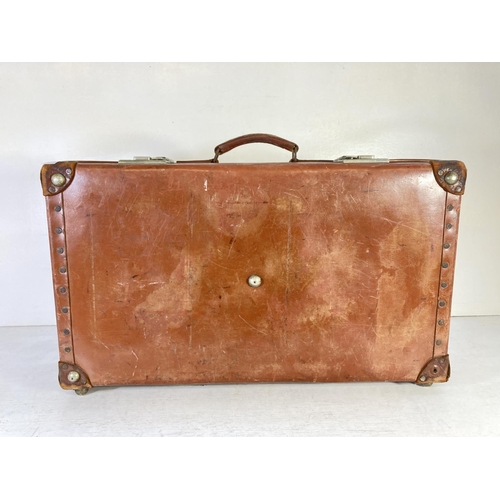 353 - A vintage Revelation brown leather suitcase