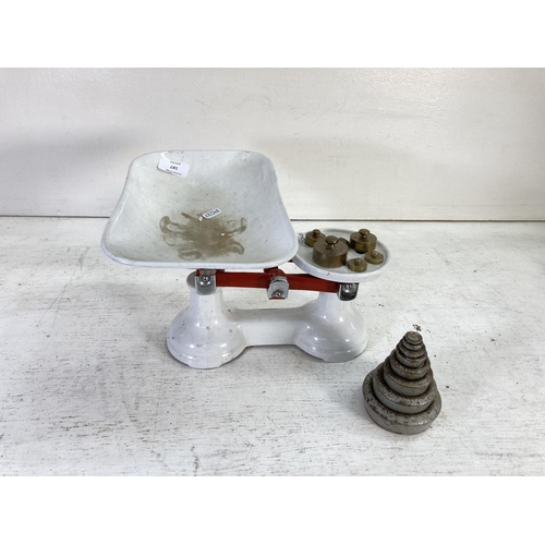 187 - A set of The Viking white and red painted cast iron weighing scales with weights