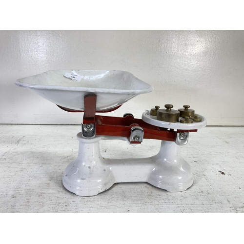 187 - A set of The Viking white and red painted cast iron weighing scales with weights