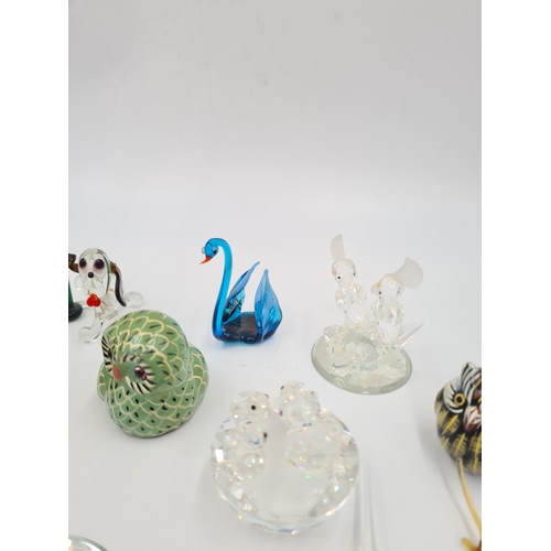 36 - A collection of ceramic and glass animal figurines to include Swarovski crystal, Venetian glass, han... 