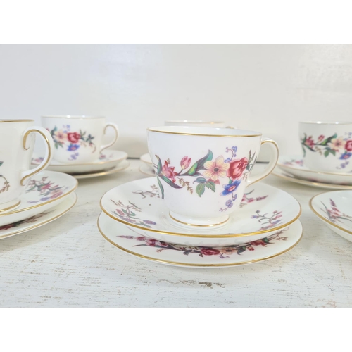 49B - A collection of Wedgwood W4076 Devon Sprays china to include seven tea cups, seven saucers, six side... 