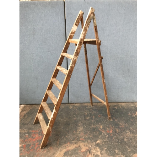 632 - Three step ladders, one aluminium and two wooden