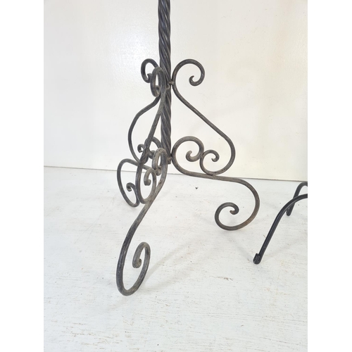 185D - Three wrought iron candle holders - largest approx. 93cm high