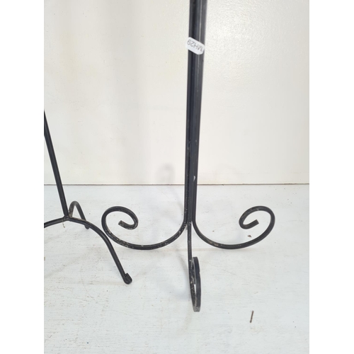 185D - Three wrought iron candle holders - largest approx. 93cm high