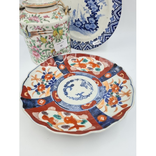 31 - Three pieces of Oriental porcelain, two 19th century plates, blue and white approx. 22cm diameter an... 