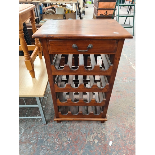 368A - Three pieces of modern furniture, one hardwood sixteen section bottle rack with upper drawer -approx... 