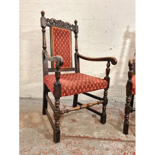 385 - A pair of Victorian style carved oak carver dining chairs with red upholstery - approx. 112cm high x... 