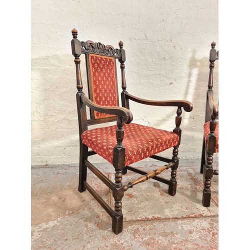 385 - A pair of Victorian style carved oak carver dining chairs with red upholstery - approx. 112cm high x... 