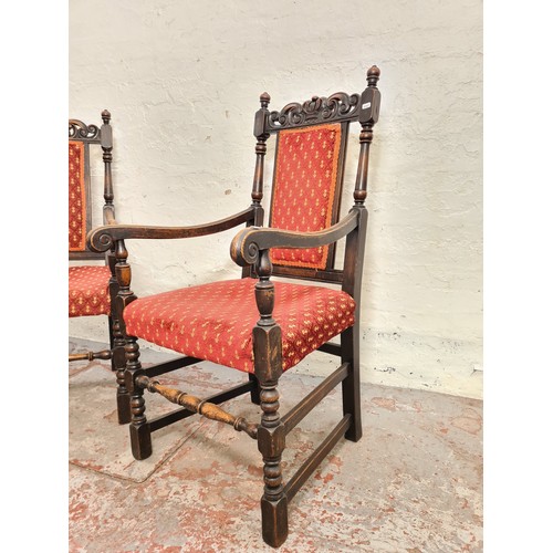 385 - A pair of Victorian style carved oak carver dining chairs with red upholstery - approx. 112cm high x... 