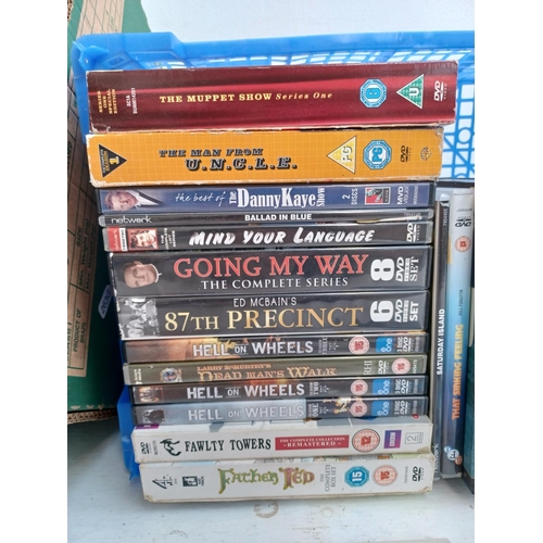 550 - Two boxes containing a collection of DVDs to include John Wayne The John Ford Collection, The Muppet... 