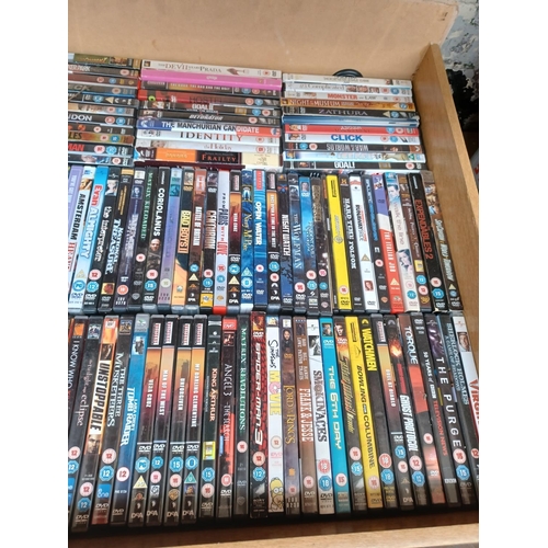 555 - Five boxes containing a large collection of DVDs to include Resistance, Donny Brasco, Wanted, True R... 