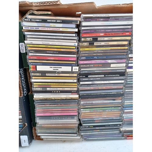 556 - Two boxes containing a collection of CD singles to include The Offspring, Ruff Driverz, Pretenders, ... 