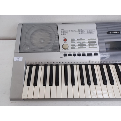 565 - A Yamaha PSR-295 electronic home keyboard