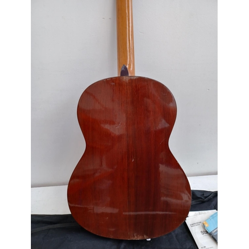 566 - A cased Japanese Hokada 3162 full size nylon strung classical guitar with cased music stand, Eno ele... 