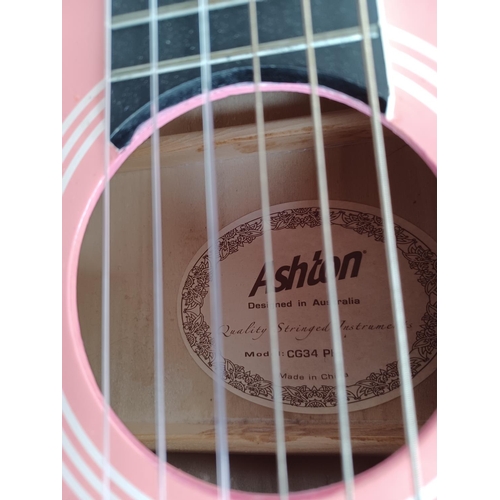 567 - Four guitars to include Ashton CG34PK ¾ size nylon strung (strung left handed), Eastwood steel strun... 