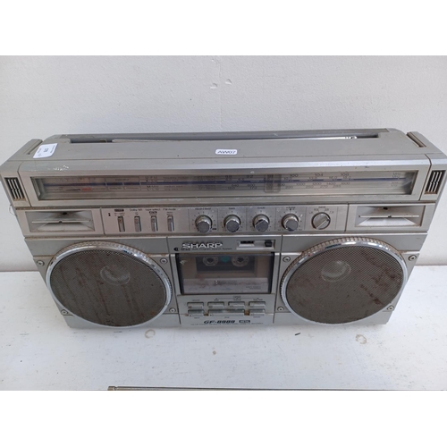 578 - Four 4-band radios, one Sharp GF-8989 with Dolby cassette recorder, one Sony ICF-1200, one Sanyo RP8... 