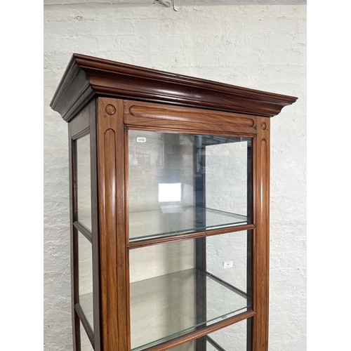 429 - A 19th century style simulated rosewood and glass display cabinet with single door and four internal... 