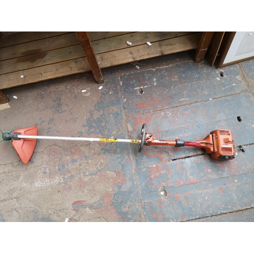 650 - A Husqvarna 225L petrol powered hedge trimmer