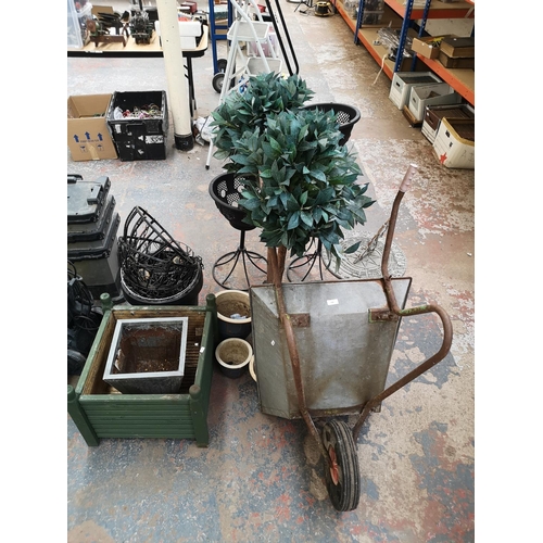 658 - A large collection of assorted garden equipment and accessories to include galvanised wheelbarrow, b... 