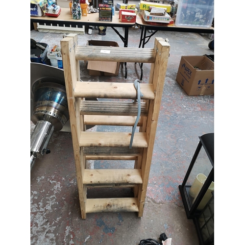 662 - A pine loft ladder - approx. height when collapsed 103cm