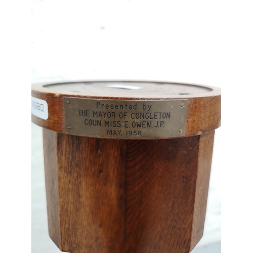 357 - A mid 20th century oak torchère with presentation plaque inscribed 'Presented by the Mayor of Congle... 