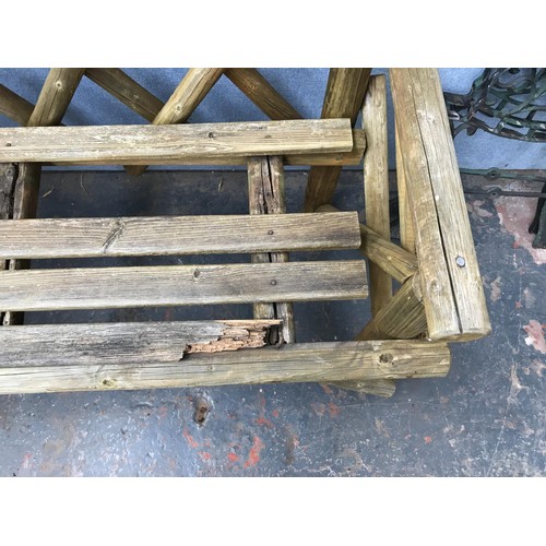 448 - Four garden related items, pine two seater bench, pair of cast iron bench ends, oak planter and set ... 