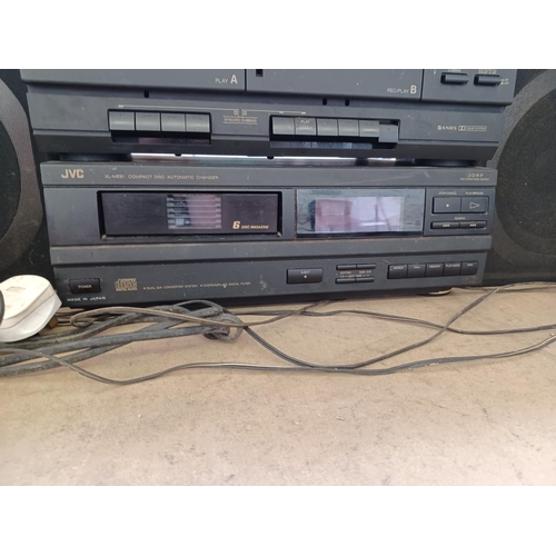 588 - A JVC hi-fi system comprising DR-E31LBK twin Dolby cassette deck/receiver, XL-ME91 six disc CD auto ... 