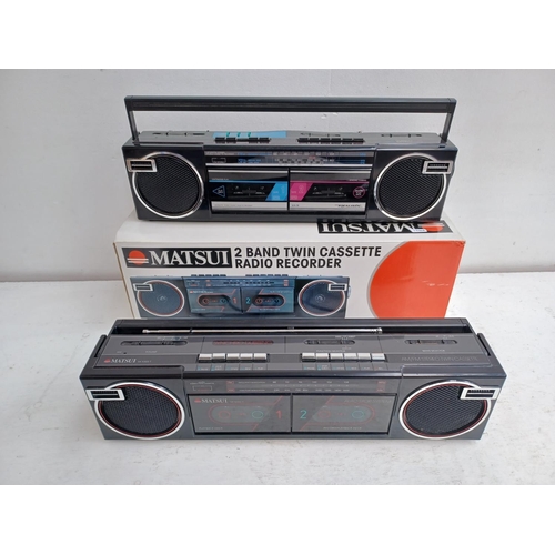 591 - Two portable radio/twin cassette recorders, one boxed Matsui SX5322T two band and one Realistic SCR-... 