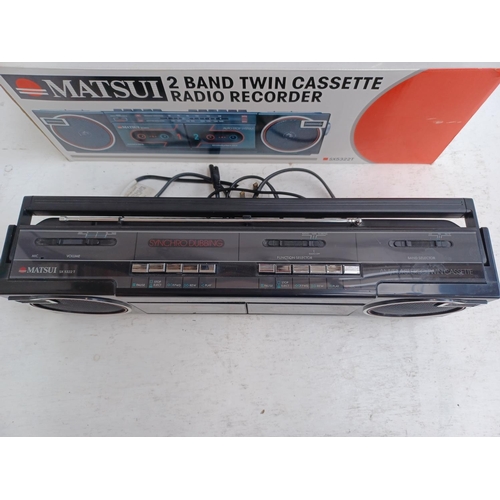 591 - Two portable radio/twin cassette recorders, one boxed Matsui SX5322T two band and one Realistic SCR-... 