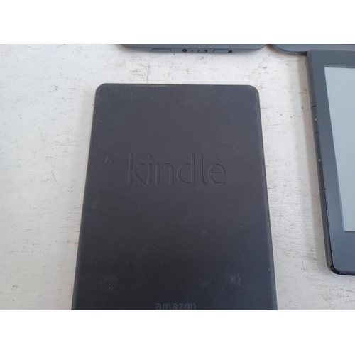 604 - Eight Amazon Kindle items, one tablet and seven e-readers