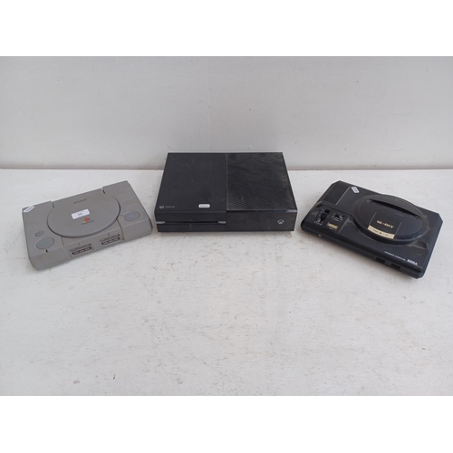 606 - Three games consoles, one Sony Playstation, one Sega Megadrive and one Xbox 1