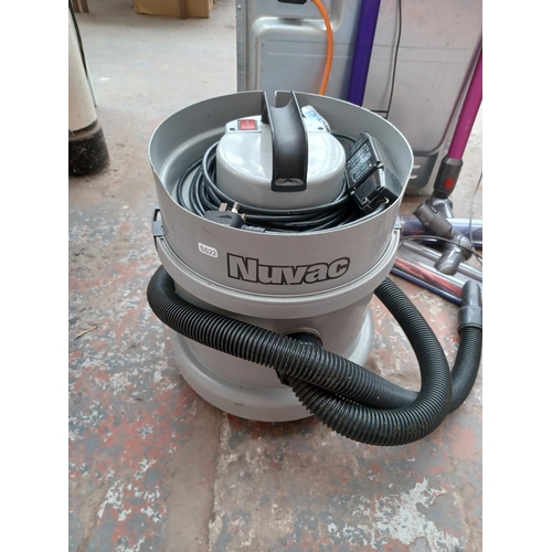 619 - Three vacuum cleaners, one Dyson V6 upright cordless bagless with charger and attachments, one Dyson... 