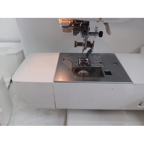 612 - A cased Brother Super Galaxie 3000D 107 pre-programme stitch sewing/embroidery machine with instruct... 