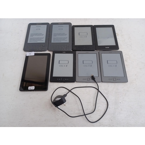 604 - Eight Amazon Kindle items, one tablet and seven e-readers