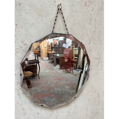 484 - A mid 20th century Art Deco style twelve sided bevelled edge wall hanging mirror