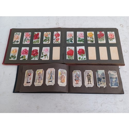 295 - A collection of vintage cigarette card albums to include Wills's Roses, Garden Life, Aviation, Crick... 