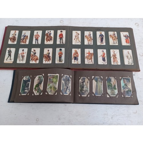 295 - A collection of vintage cigarette card albums to include Wills's Roses, Garden Life, Aviation, Crick... 